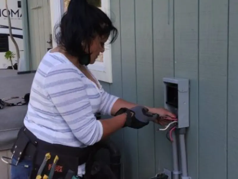 Licensed electrician wiring an exterior subpanel in Payson