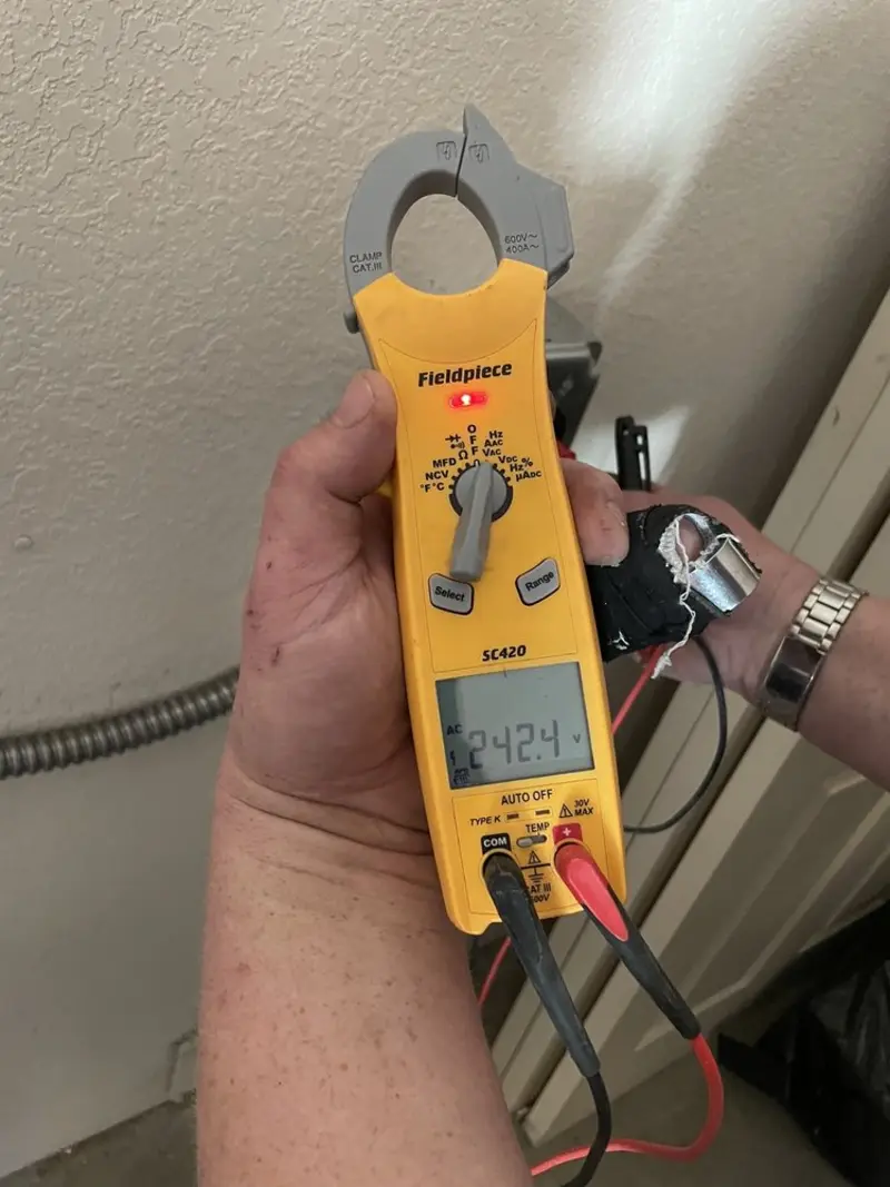 Voltage testing with clamp meter during Ceiling Fan Installation in Payson
